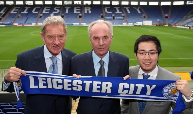 Sven Goran Eriksson at the Leicester City ground holding one of the club's branded scarves at the start of his time as manager