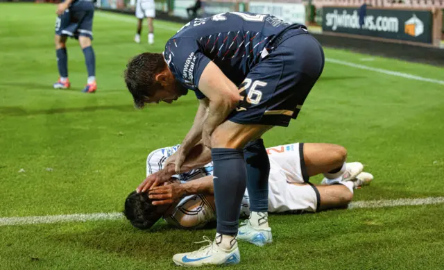 DUNFERMLINE, SCOTLAND - SEPTEMBER 13: Raith's Lewis Stevenson checks on Dunfermline's Aaron Comrie during a William Hill Championship match between Dunfermline and Raith Rovers at KDM Group East End Park, on September 13, 2024, in Dunfermline, Scotland. (Photo by Mark Scates / SNS Group)