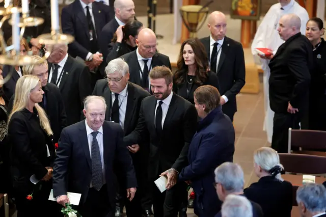 Former England captain David Beckham leaves the church