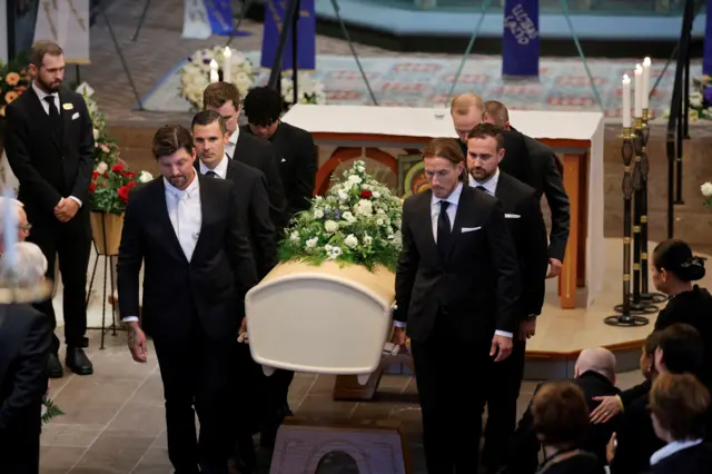 Pallbearers carry the coffin of Sven-Goran Eriksson at Fryksande church