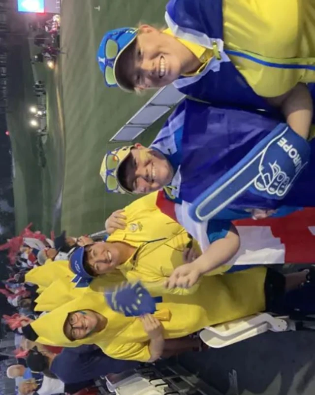 Fans in banana outfits