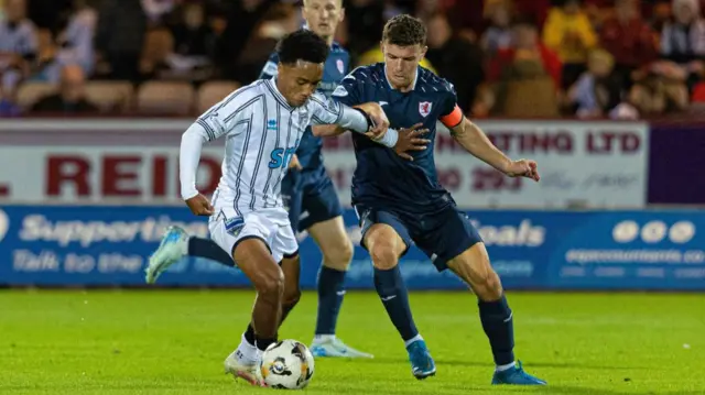 DUNFERMLINE, SCOTLAND - SEPTEMBER 13: Dunfermline's Kane Ritchie-Hosler (L) and Raith's Ross Matthews in action during a William Hill Championship match between Dunfermline and Raith Rovers at KDM Group East End Park, on September 13, 2024, in Dunfermline, Scotland. (Photo by Mark Scates / SNS Group)