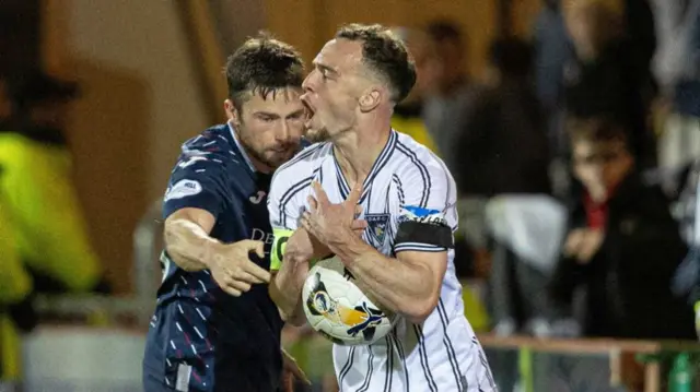 DUNFERMLINE, SCOTLAND - SEPTEMBER 13: Dunfermline's Kyle Benedictus (R) and Raith's Lewis Stevenson in action during a William Hill Championship match between Dunfermline and Raith Rovers at KDM Group East End Park, on September 13, 2024, in Dunfermline, Scotland. (Photo by Mark Scates / SNS Group)