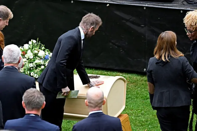 Former England captain David Beckham pays his final respects to the late manager