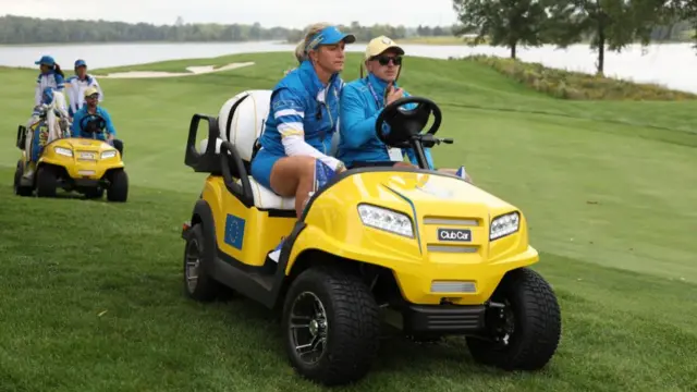 Suzann Pettersen travels round the course