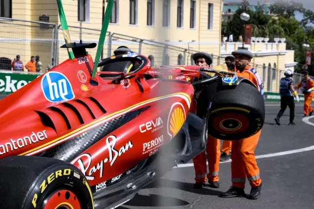 Charles Leclerc's car is recovered after his crash in first practice