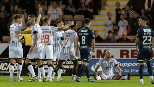 DUNFERMLINE, SCOTLAND - SEPTEMBER 13: Raith's Euan Murray (not in frame) is sent off for a push on Dunfermline's Chris Kane (R) during a William Hill Championship match between Dunfermline and Raith Rovers at KDM Group East End Park, on September 13, 2024, in Dunfermline, Scotland. (Photo by Mark Scates / SNS Group)