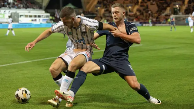 DUNFERMLINE, SCOTLAND - SEPTEMBER 13: Dunfermline's Tommy Fogarty (L) and Raith's Callum Smith in action during a William Hill Championship match between Dunfermline and Raith Rovers at KDM Group East End Park, on September 13, 2024, in Dunfermline, Scotland. (Photo by Mark Scates / SNS Group)