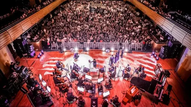 Self Esteem and Royal Northern Sinfonia on stage with the audience in the background