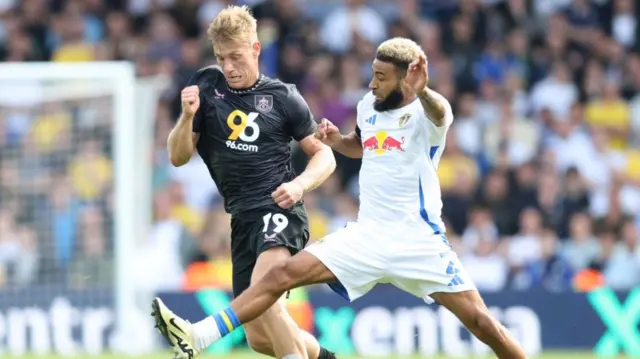 Burnley and Leeds players challenge for the ball