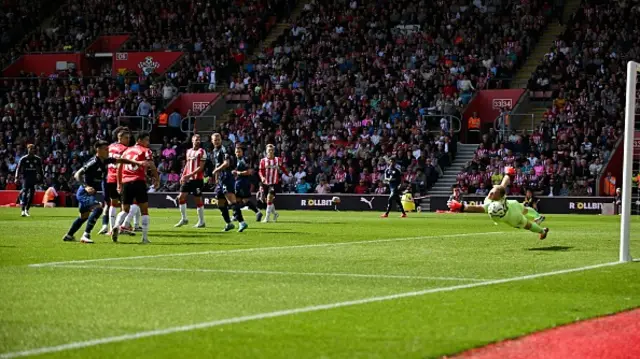 Marcus Rashford (L) shoots