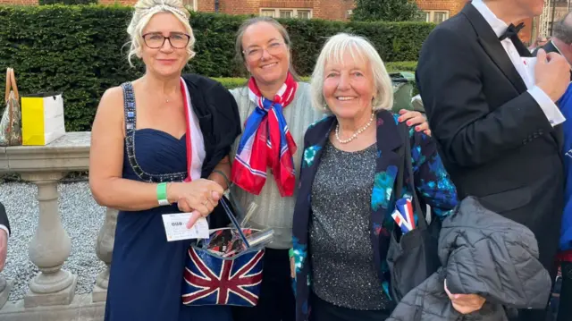 Three people ready for the Proms