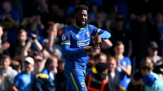 Myles Hippolyte celebrates putting AFC Wimbledon 1-0 up against MK Dons at Plough Lane