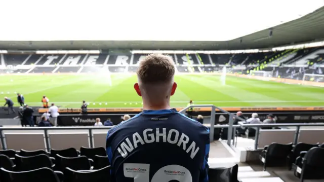 A Derby fan sat in the stands before kick off