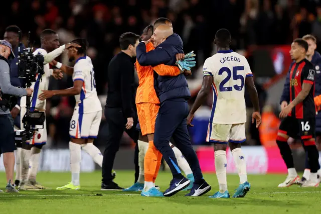 Enzo Maresca hugs Robert Sanchez