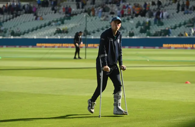 Tom Banton on crutches