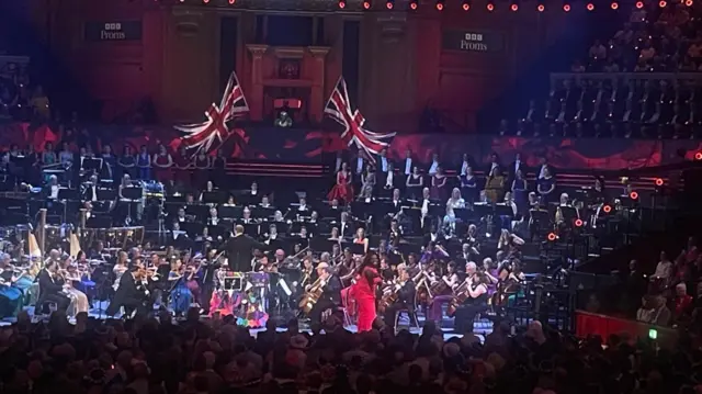 Angel Blue throwing a rose to the crowd at the Royal Albert Hall