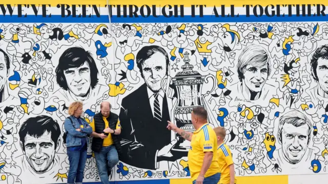 Fans outside a Leeds mural