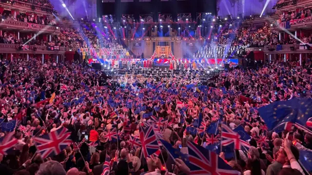 Crowd stands at Last Night of the Proms