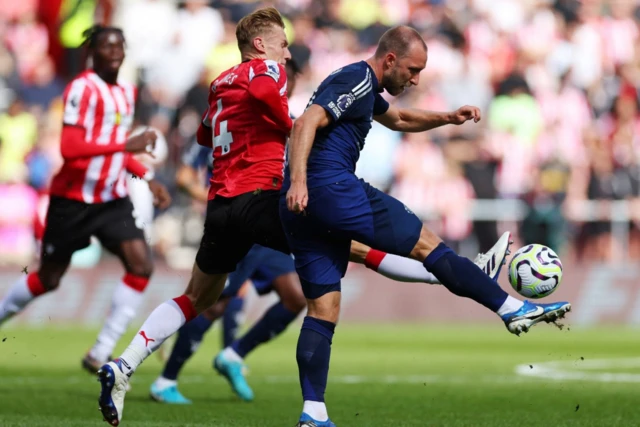 Southampton's Flynn Downes in action with Manchester United's Christian Eriksen