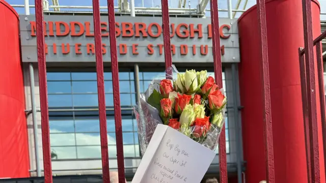 Flowers on the gate outside the Riverside