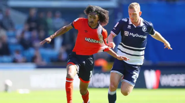 Tahith Chong (left) challenging for the ball