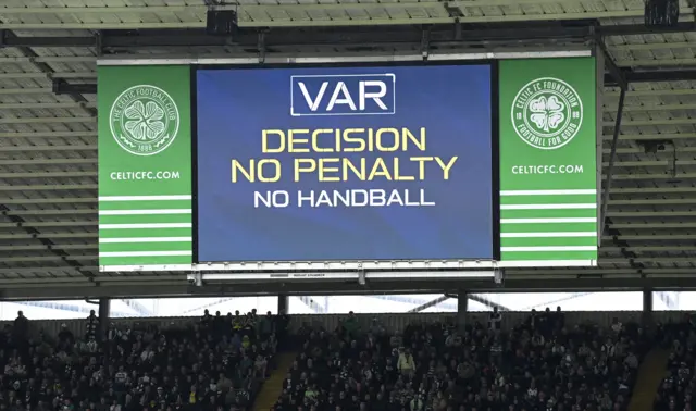 A screen at Celtic Park says 'no penalty'