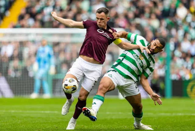 Hearts striker Lawrence Shankland tussles with Celtic goalkeeper Cameron Carter-Vickers