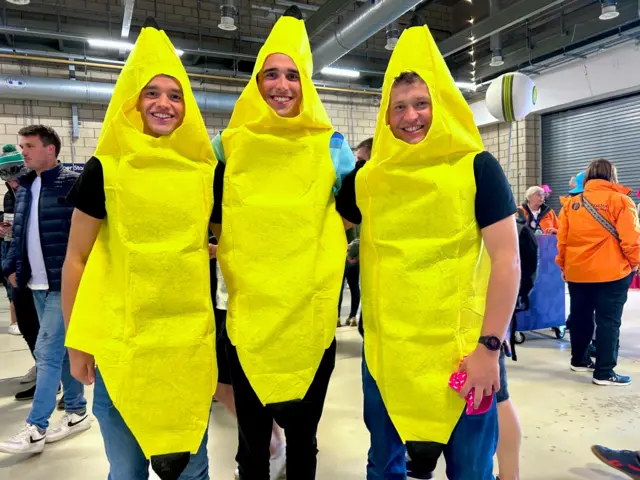 Three men dressed in banana outfits