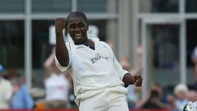 Mark Alleyne celebrates taking a wicket for Gloucestershire