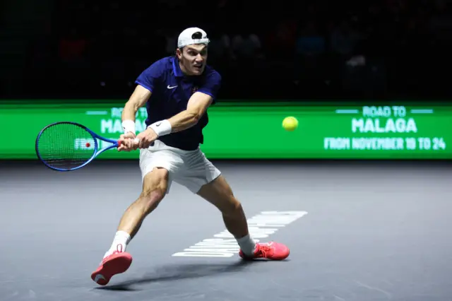 Jack Draper of Great Britain plays a backhand against Francisco Cerundolo of Argentina