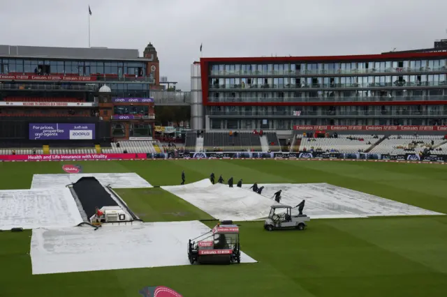 A cover being removed at Old Trafford