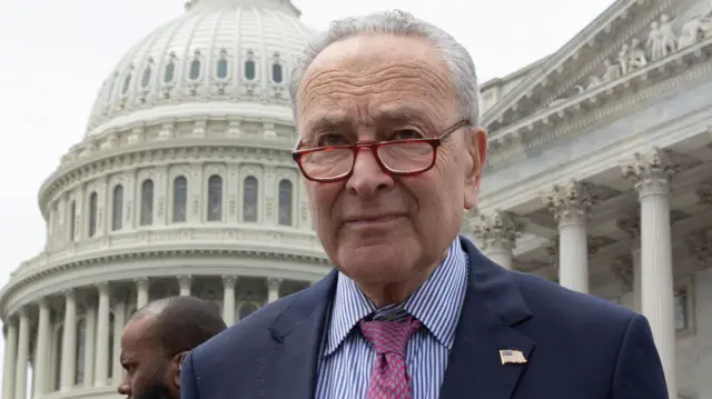 Senate Majority Leader Chuck Schumer walks outside the US Capitol Building