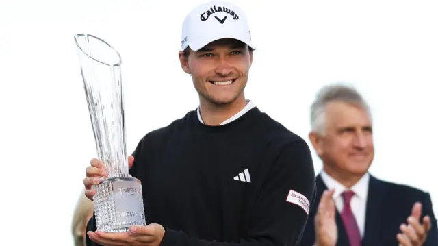 Rasmus Hojgaard holds the Irish Open trophy after his triumph at Royal County Down