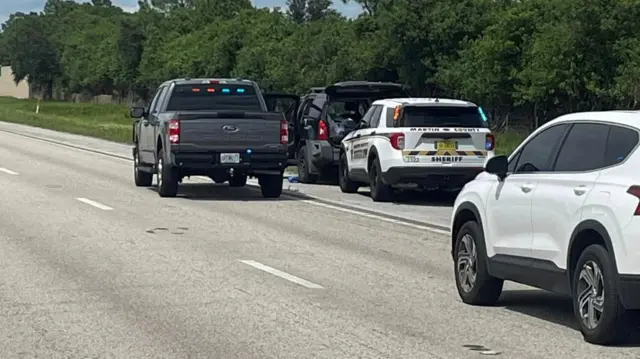 Police vehicles are seen at a scene following reports of multiple shots fired near the golf course of Republican presidential candidate Donald Trump, in West Palm Beach, Florida, US, September 15, 2024