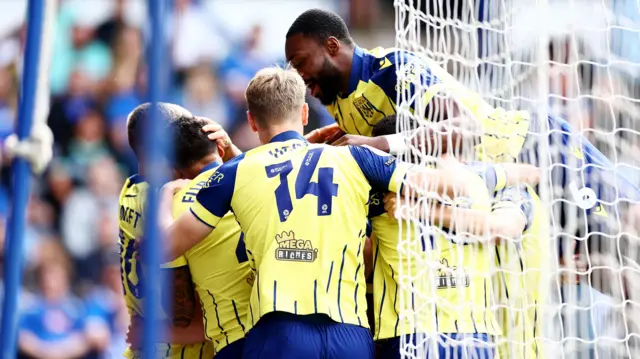 West Bromwich Albion players celebrate the opening goal