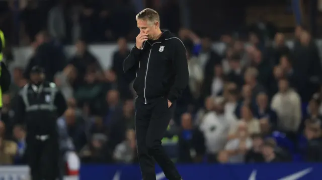 Wrexham manager Phil Parkinson looks dejected following their defeat to Birmingham City.