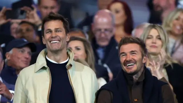 Tom Brady and David Beckham watching at St Andrew's