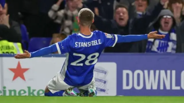 Jay Stansfield celebrates in front of supporters