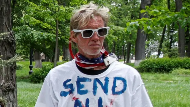 Ryan W. Routh, a suspect identified by news organizations, as the FBI investigates what they said was an apparent assassination attempt in Florida on Republican presidential nominee and former U.S. President Donald Trump, is seen during a rally demanding China's leader's assistance to organise an extraction process for Ukrainian service members from Azovstal Iron and Steel Works in Mariupol, in Kyiv, Ukraine