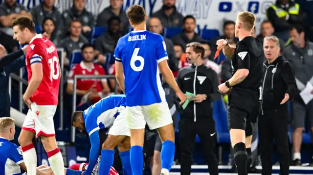 Birmingham City's Krystian Bielik is shown a red card.