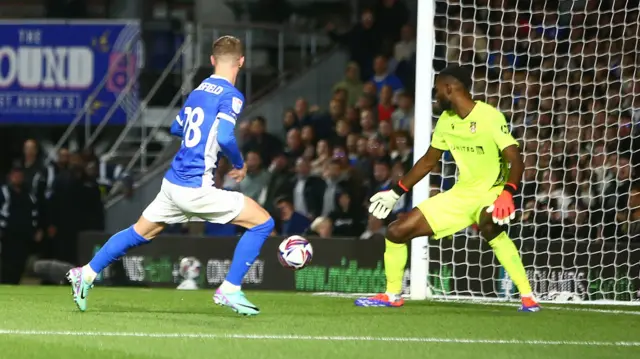 Birmingham City's Jay Stansfield places the ball to the right of Wrexham goalkeeper Arthur Okonkwo for his second of the night.