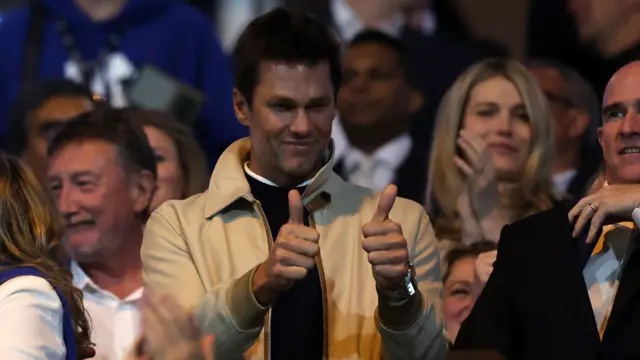 Tom Brady holds two thumbs up to Birmingham City supporters following their win over Wrexham.