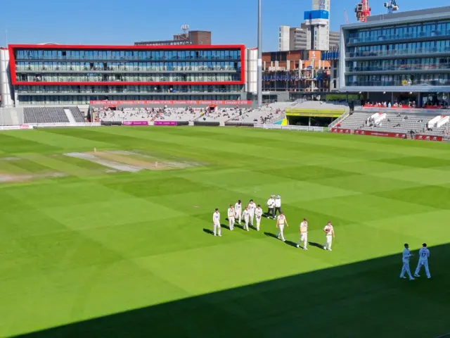 Somerset players leaving the field