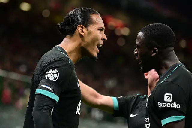 Virgil van Dijk (L) celebrates scoring his team's second goal