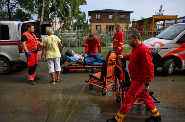 Rescue workers evacuate people from a house for seniors in Ostrava