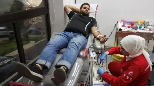 A man donates blood as more than 1,000 people, including Hezbollah fighters and medics, were wounded on Tuesday when the pagers they use to communicate exploded across Lebanon, according to a security source, at Lebanese Red Cross center in Sidon, Lebanon September 17, 2024.