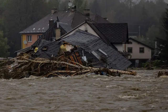 Collapsed houses in overfloating Bela river after heavy rain in town of Jesenik, Czech Republic