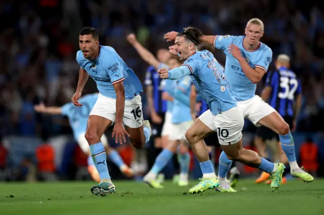 Rodri and the Manchester City players celebrate