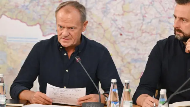 Polish Prime Minister Donald Tusk (L) and Deputy Prime Minister and Minister of National Defense Wladyslaw Kosiniak-Kamysz (R) attend a meeting of the crisis staff at the Voivodship Office in Wroclaw, southwest Poland